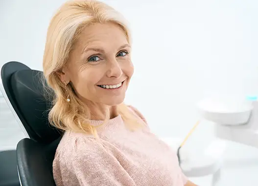 Patient smiling in the dental chair at Absolute Quality Care Family Dentistry